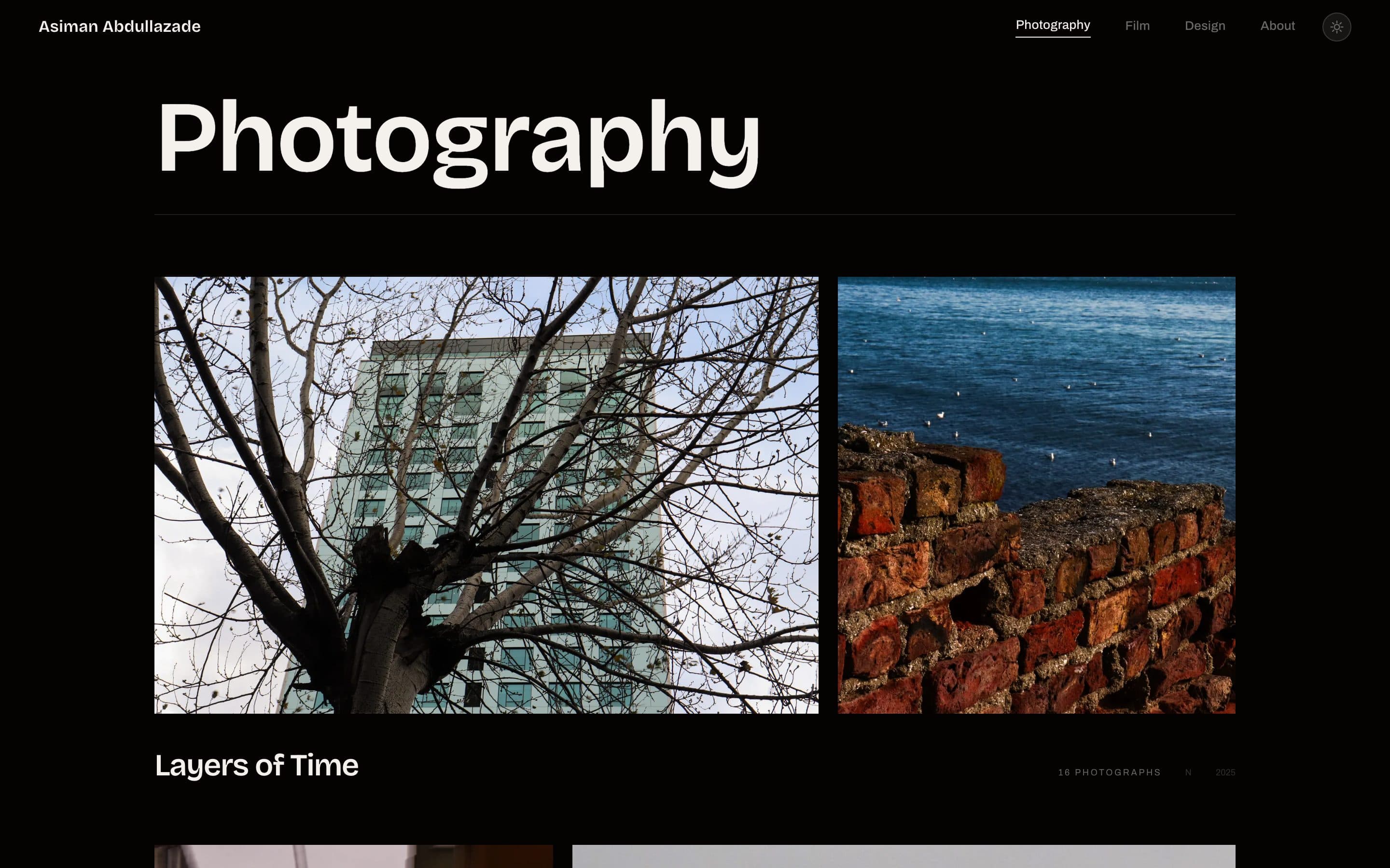 The photography room: the series “Layers of Time”, a bare tree against a tower block beside a brick wall above the sea.